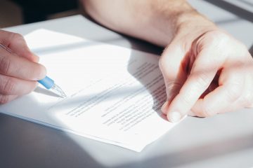 a person signing a document